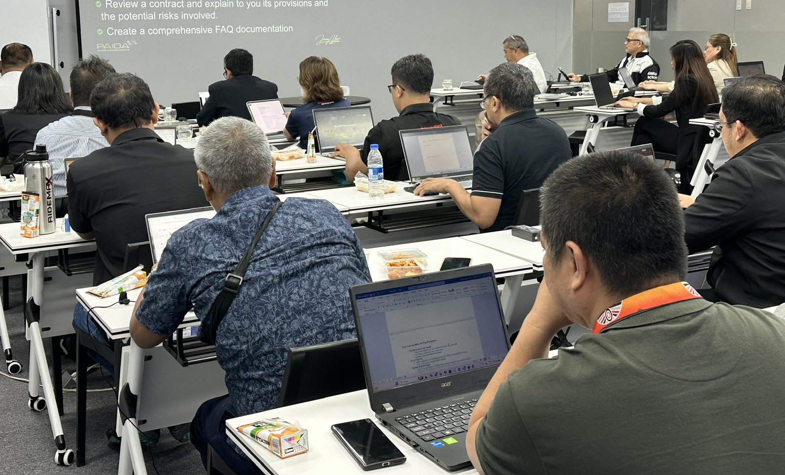 Participants analysing their own data with AI during a Tellix workshop